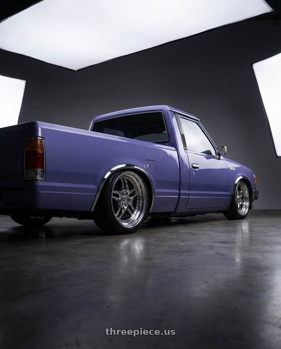 1985 nissan 720 with Heritage Wheel EBISU wheels rear three quarter view slight stretch tires