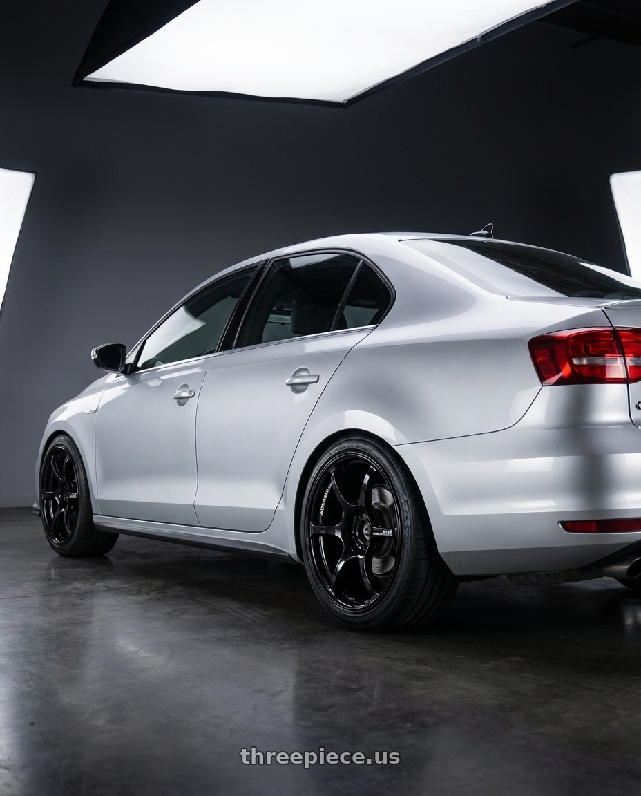 2016 Volkswagen Jetta GLI MK6 with Advan RGIII 5x112 18x8+42 Gloss Black wheels rear three quarter view square tires