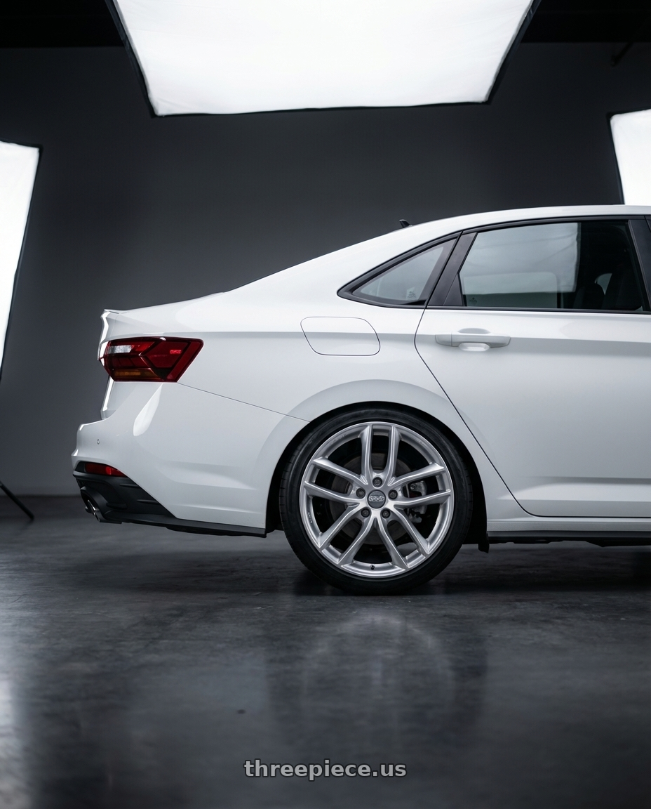 2022 Volkswagen Jetta Gli white with BBS SX 5x114.3 18x8.0+40 Sport Silver wheels rear three quarter view slight stretch tires