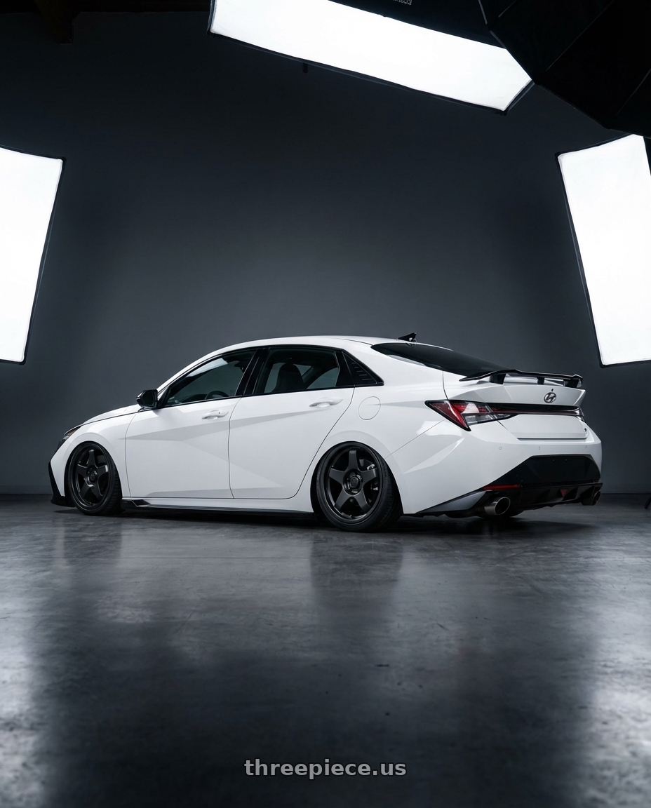 2024 Hyundai Elantra N with fifteen52 CHICANE 5x114.3 / 5x120 19x8.5 +35 ASPHALT BLACK (SATIN BLACK) wheels rear three quarter view slight stretch tires