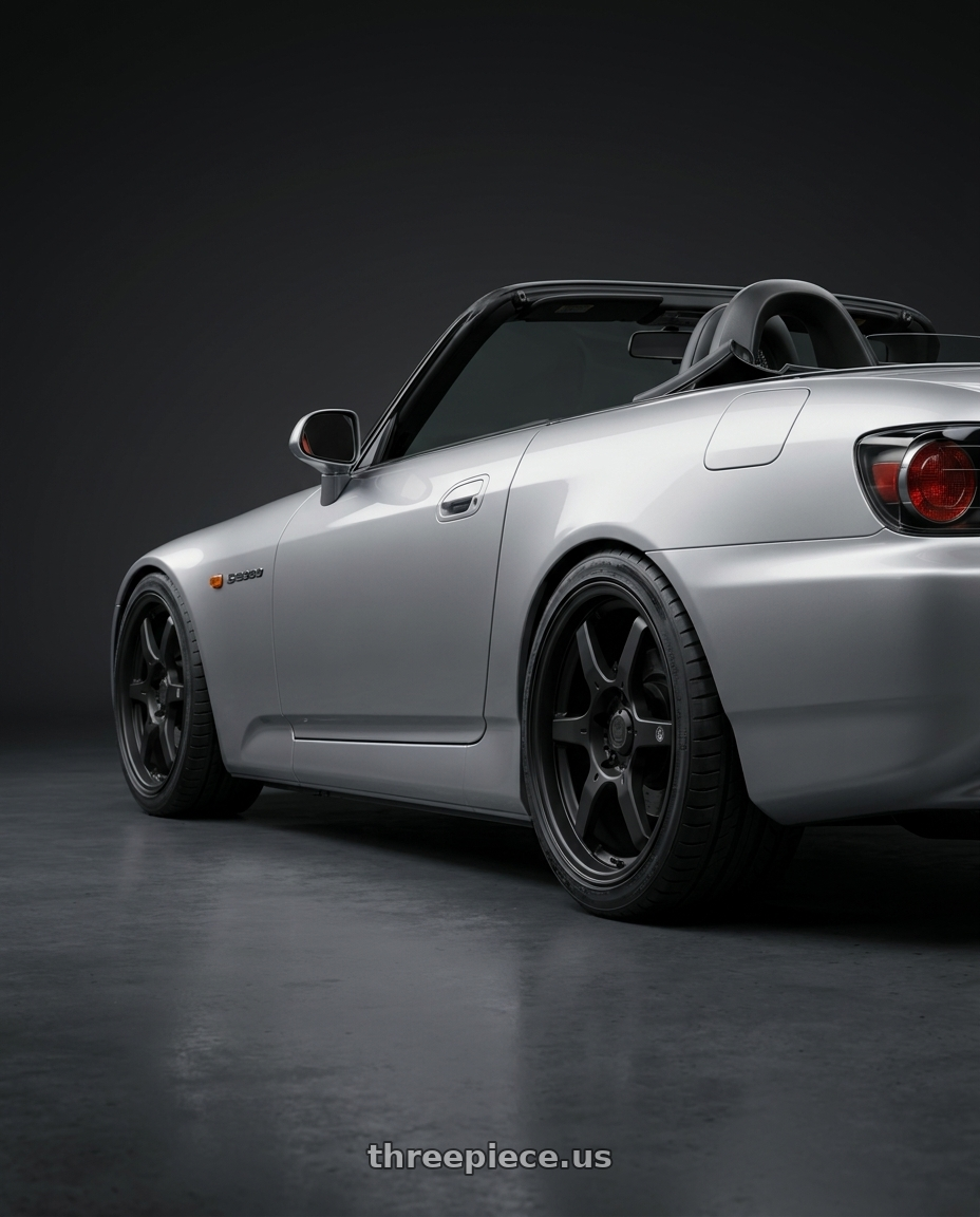 2009 Honda S2000 with Konig Backbone 5x114.3 17x7.5+35 Matte Black Milling Logo on Spoke wheels rear three quarter view square tires