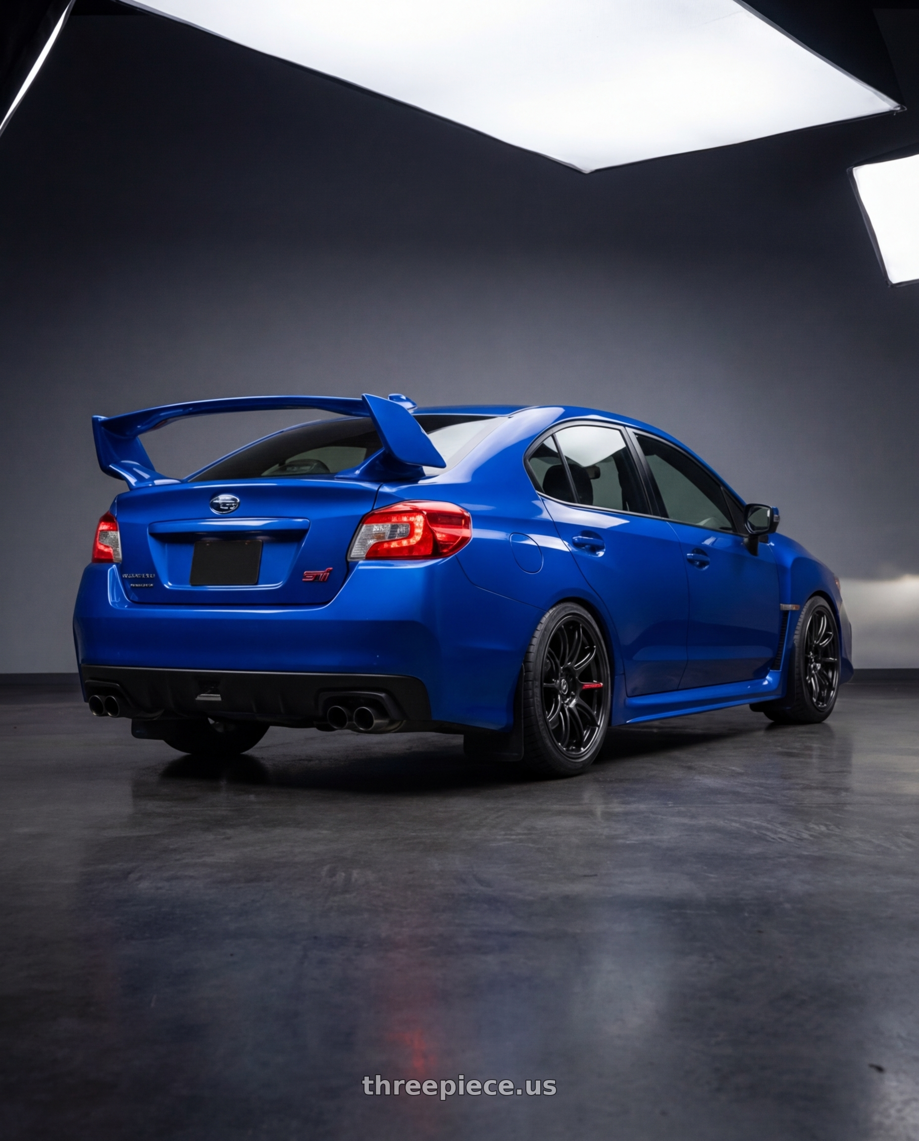 2019 Subaru WRX STI Base Blue with Work Zr10 2P 5x114.3 18x10.0 +38 Glim Black wheels rear three quarter view square tires