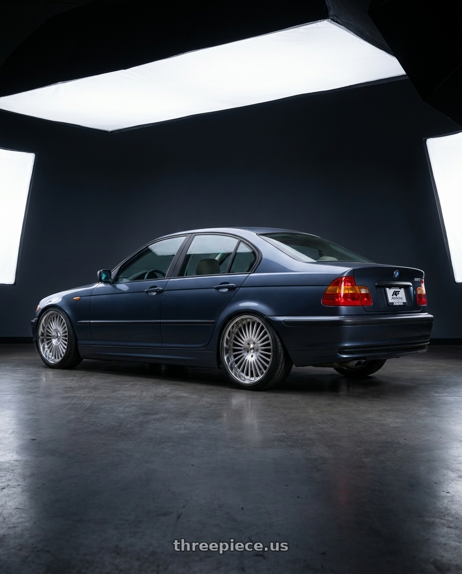 2003 bmw 325i  with Amani R.E.A.L. 5x112/5x120 22x10 +38 Brush Center Chrome Lip wheels rear three quarter view slight stretch tires