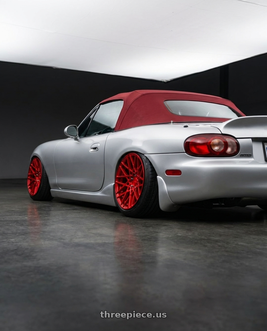 2000 Mazda Miata with Rotiform 1PC R109 BLQ 5X112 18X8.5 +45 CANDY RED wheels rear three quarter view extreme stretch tires