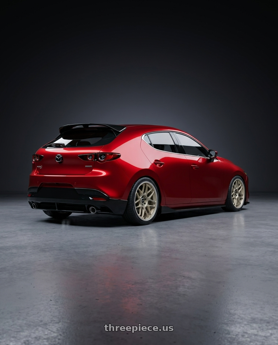 2026 Mazda 3 hatchback soul red, with appearance kit with Motegi MR158 TSUBAKI 5X114.3 18x8.5 +35 MOTORSPORT GOLD W/ MACHINED LIP wheels rear three quarter view square tires