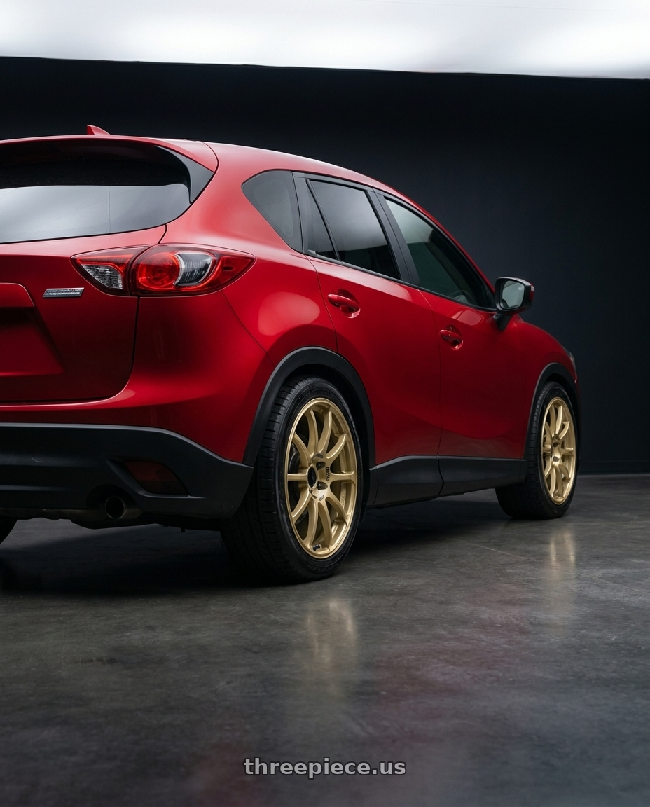 2015 Mazda Cx 5 with Advan RCIII 5x114.3 18x8.5+53 Gold wheels rear three quarter view square tires