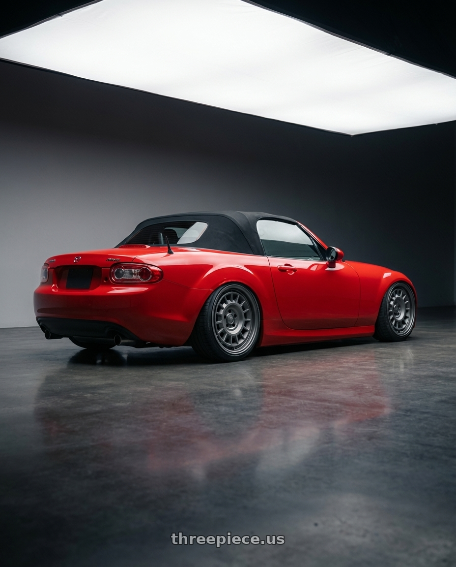2012 Mazda MX-5 Miata NC with fifteen52 ALPEN MX 5x114.3 17x8 +38 FROSTED GRAPHITE (SATIN GREY) wheels rear three quarter view slight stretch tires