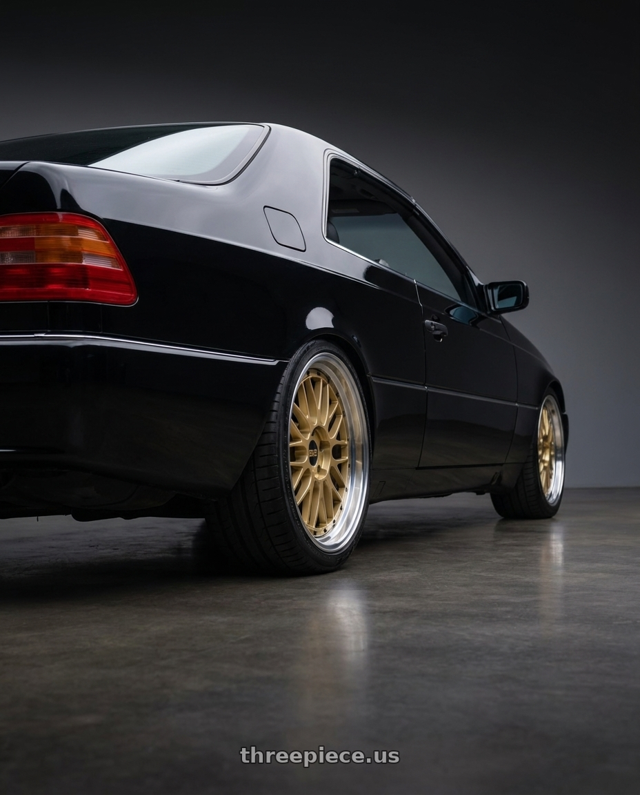 1998 Mercedes CL 500 with BBS LM 5x112 19x9.0+42 Gold wheels rear three quarter view square tires