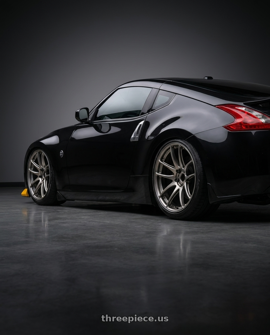 2009 nissan 370z with WORK Emotion CR Shigoku 5x114.3 19x10.5 +12 Glow Gunmetal GGM wheels rear three quarter view slight stretch tires