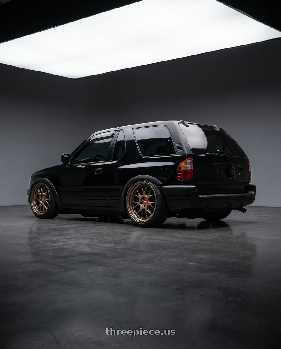 2000 isuzu amigo with BBS LM-R 5x120 20x9.5+23 Matte Bronze wheels rear three quarter view slight stretch tires