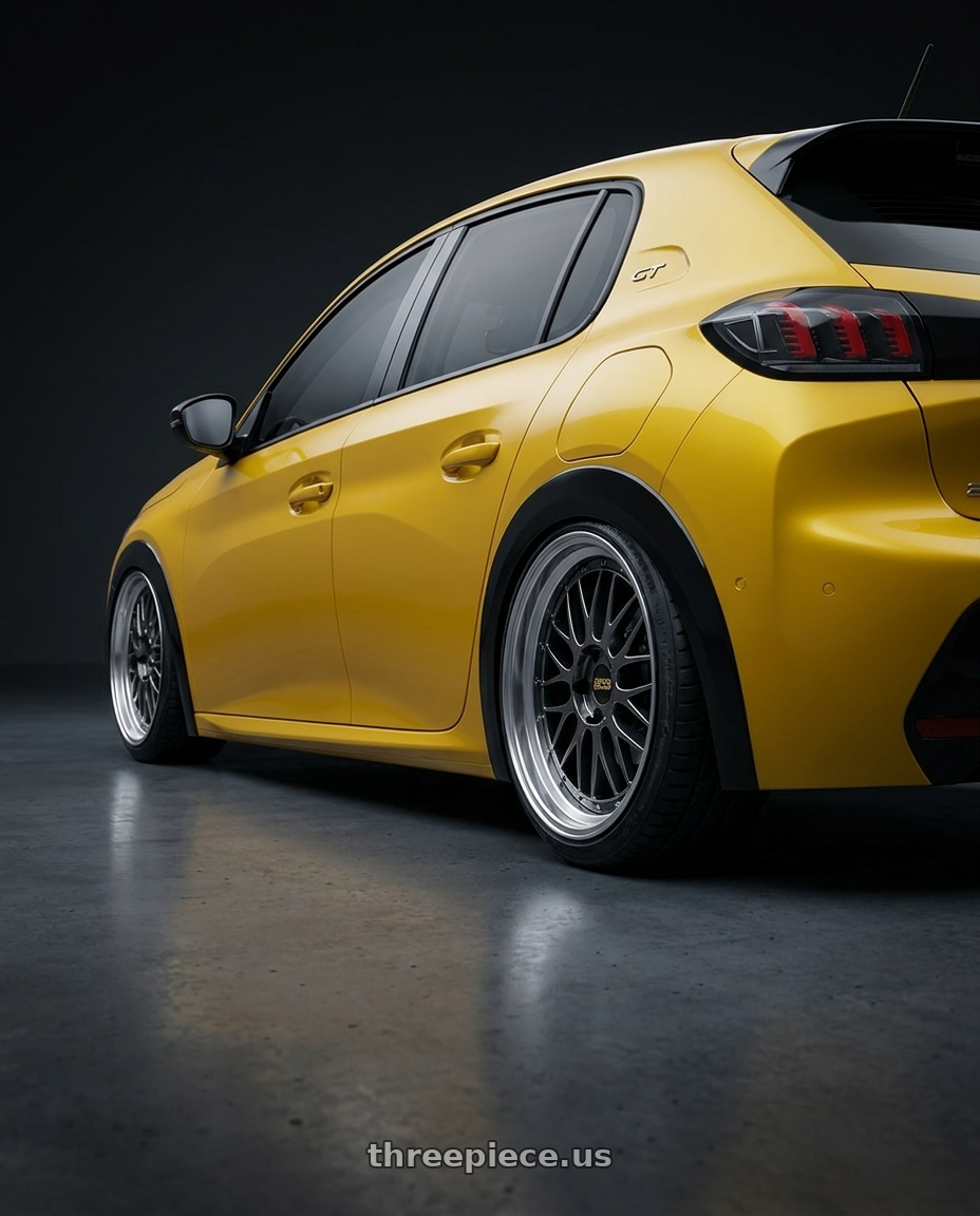 2021 Peugeot 208 with BBS LM 5x114.3 18x9.0+42 Diamond Black wheels rear three quarter view extreme stretch tires