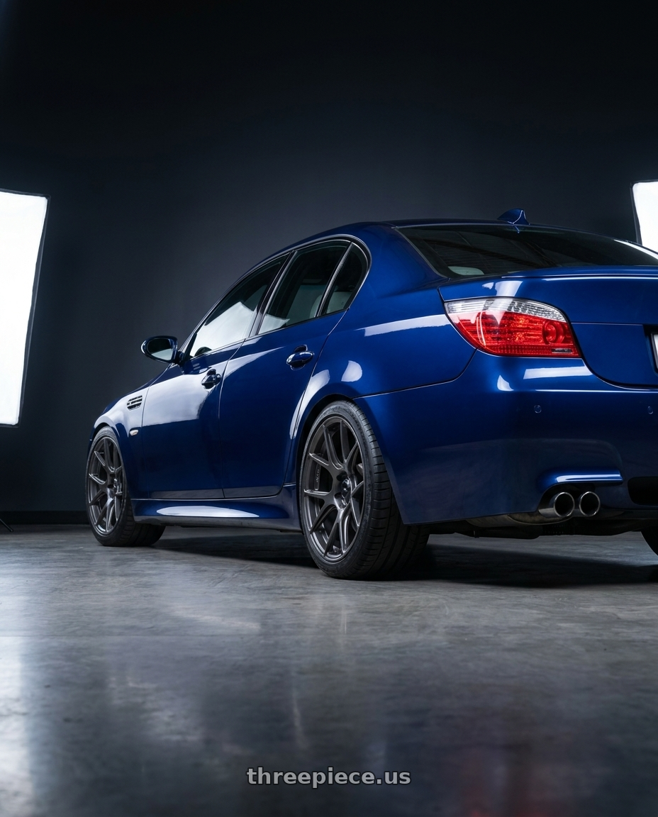 2010 BMW M5 E60 with Konig Ampliform 5x120 19x10+28 Dark Metallic Graphite wheels rear three quarter view square tires