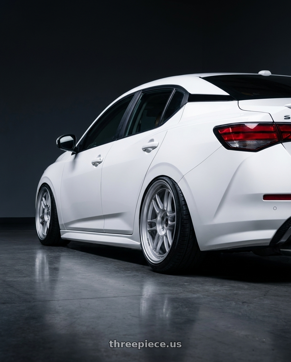 2022 nissan sentra  with Enkei RPF1 5x114.3 18x8+35 Silver wheels rear three quarter view slight stretch tires