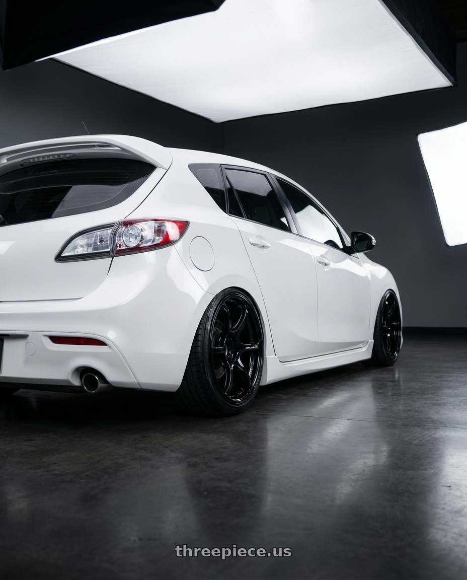 2012 Mazda Mazdaspeed3 with Advan RGIII 5x114.3 18x9.0+35 Gloss Black wheels rear three quarter view slight stretch tires