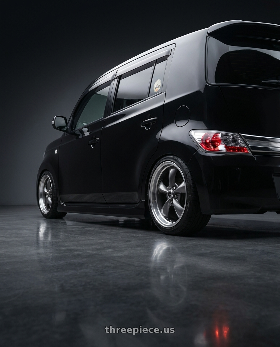 2006 Daihatsu Coo with American Racing AR105 TORQ THRUST M 5X114.3 17X7 0 ANTHRACITE W/ MACHINED LIP wheels rear three quarter view square tires