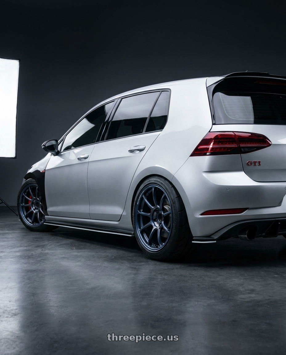2019 golf gti with Volk Racing ZE40 Time Attack III 5x112 18x8.5+43 Metallic Blue / Matte Dark Clear LM wheels rear three quarter view meaty tires