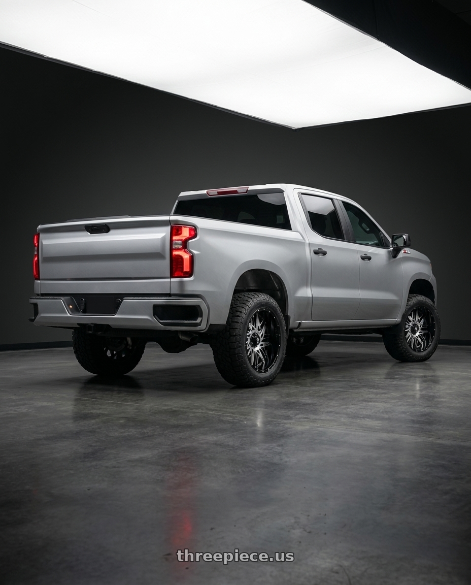 2026 Chevrolet Silverado 1500 custom trailer boss with American Truxx Dna AT184 6x139.7 20x9+0 Black/Machined wheels rear three quarter view square tires