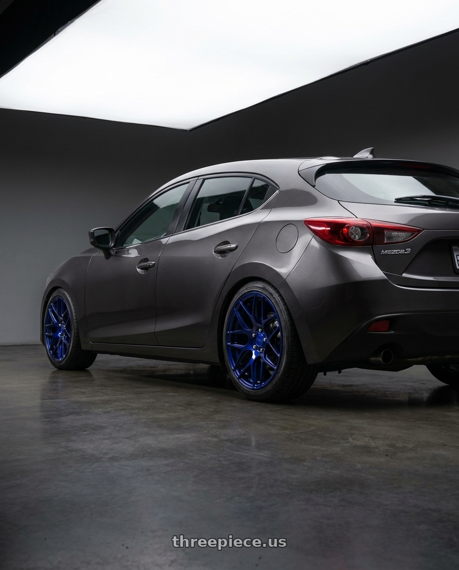 2013 Mazda3 5D with MRR FS1 5x130 18x8.5  +45 Candy Blue wheels rear three quarter view square tires