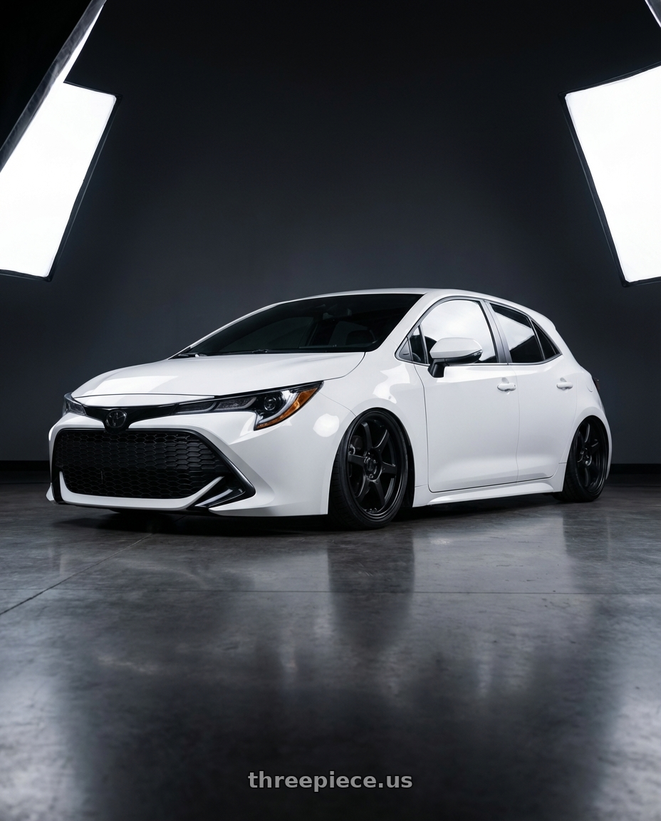 2023 Toyota Corolla Hatchback with Konig Backbone 5x114.3 18x8+35 Matte Black Milling Logo on Spoke wheels front three quarter view stanced stance