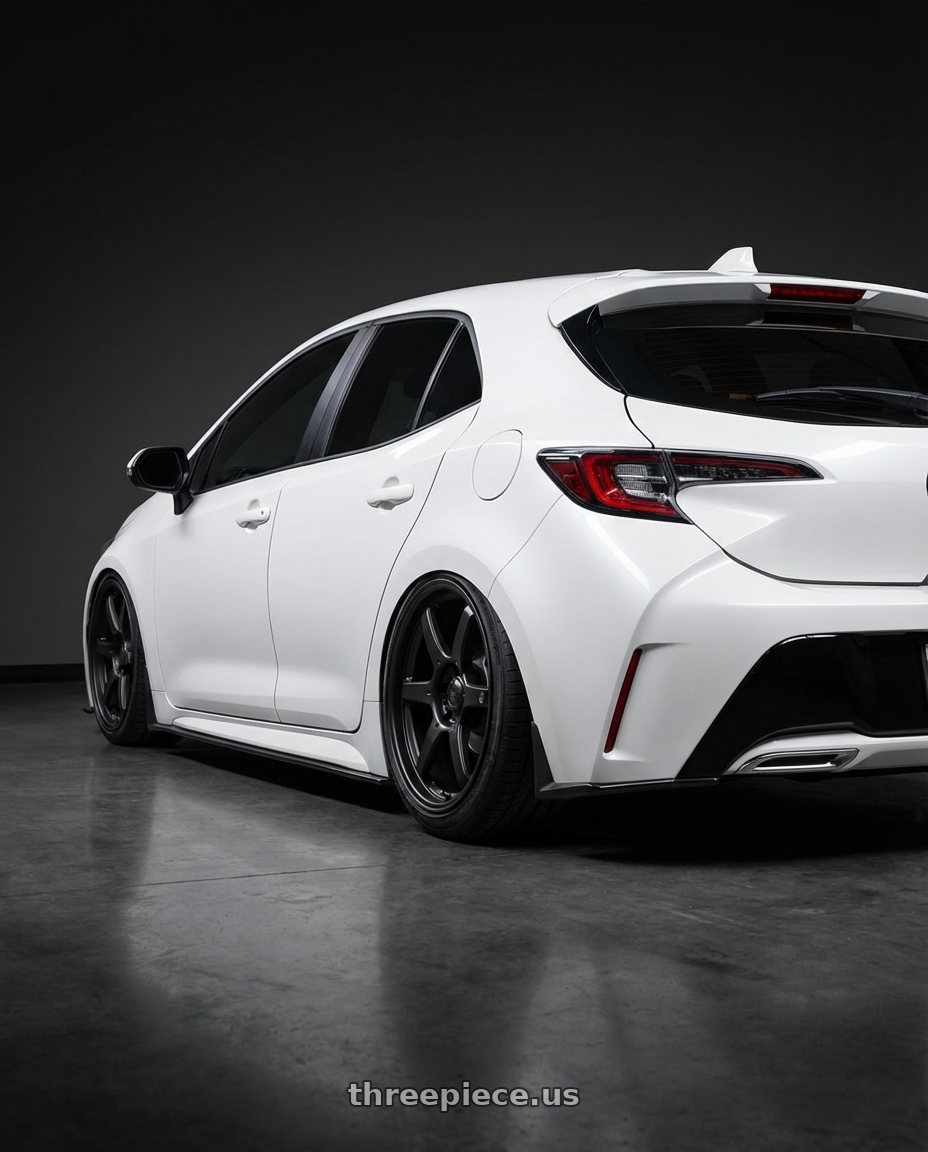 2023 Toyota Corolla Hatchback with Konig Backbone 5x114.3 18x8+35 Matte Black Milling Logo on Spoke wheels rear three quarter view slight stretch tires