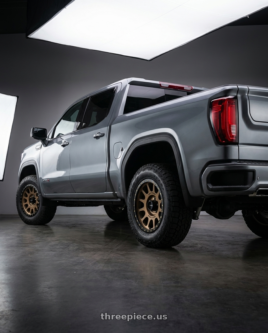 2021 GMC Sierra 1500 AT4 with Method Race Wheels 305BZ NV 6x139.7 18x9 -12 METHOD BRONZE wheels rear three quarter view square tires