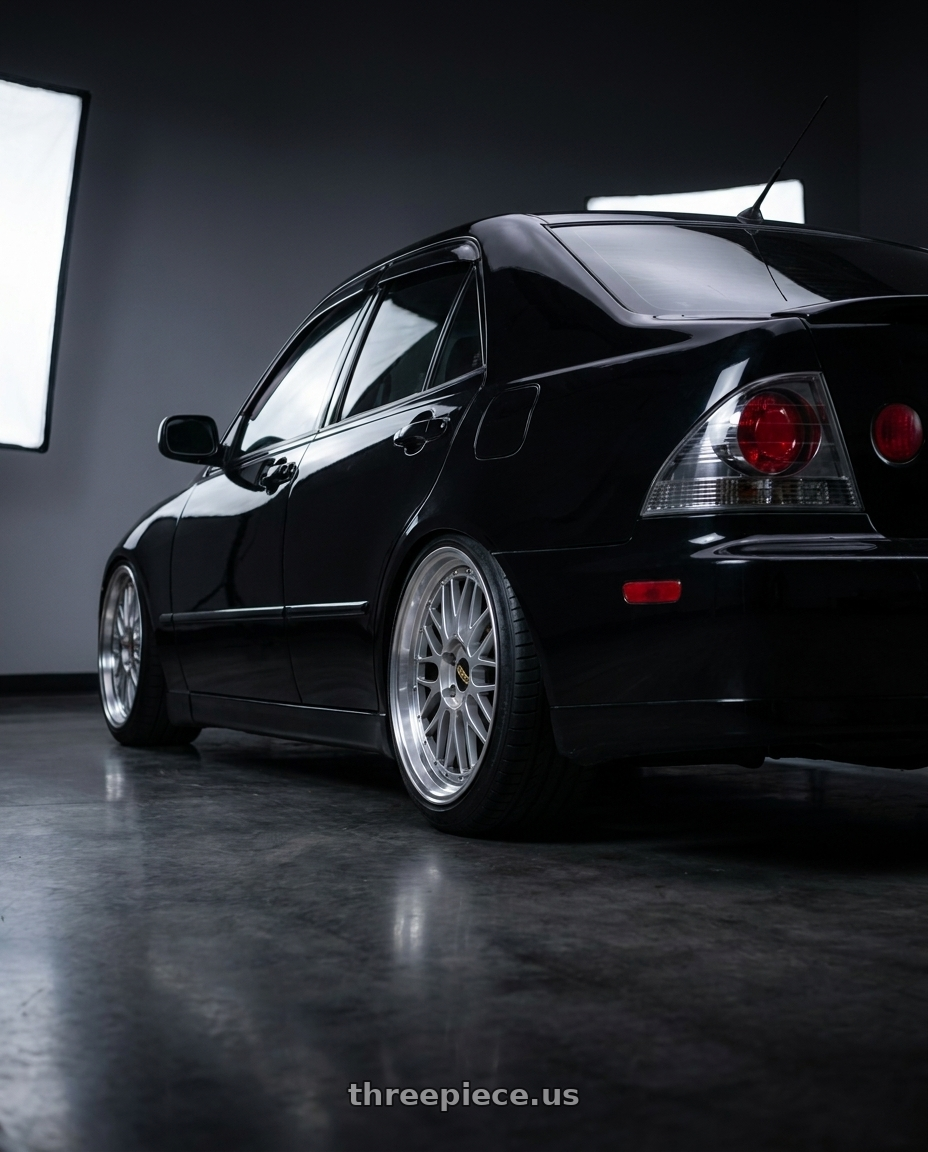 2004 Lexus IS300 with BBS LM 5x114.3 18x9.0+25 Diamond Silver wheels rear three quarter view slight stretch tires