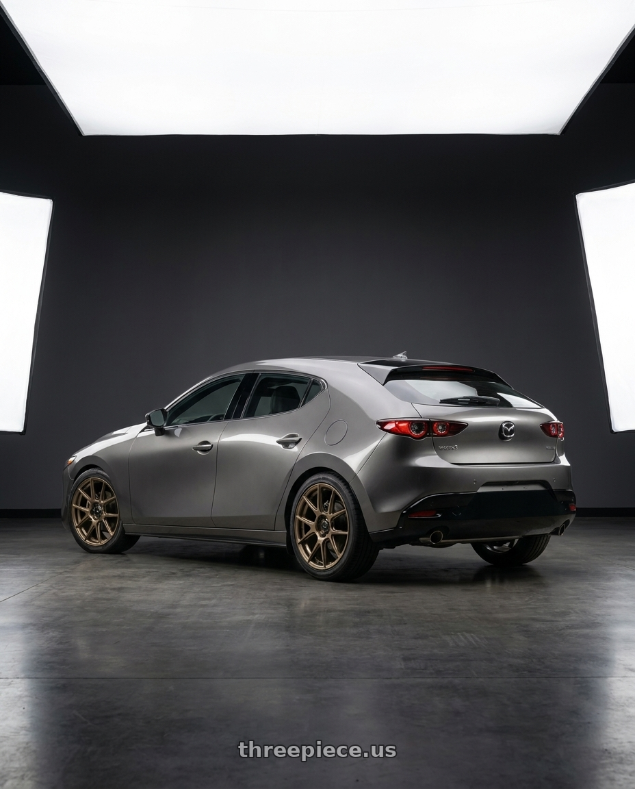 2023 Mazda3 Hatchback with Konig Ampliform 5x114.3 18x8.5+45 Gloss Bronze wheels rear three quarter view square tires
