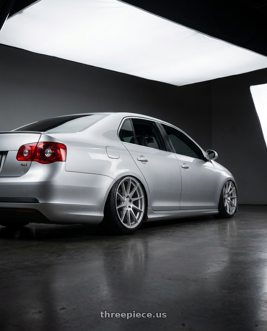 2009 Volkswagen Jetta GLI MK5 with Aodhan AH09 5x112 18x8.5 +35 Gloss Silver Machined Face wheels rear three quarter view slight stretch tires