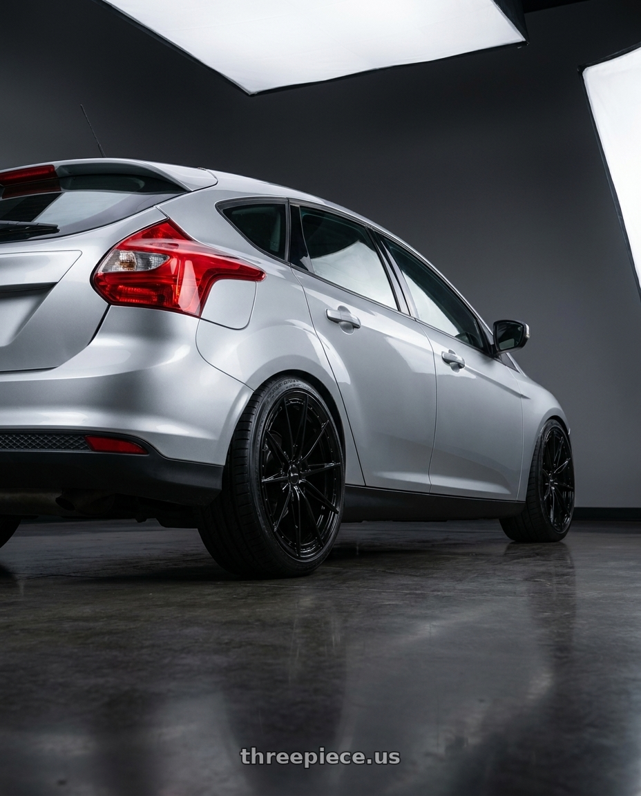 2014 ford focus mk3 1.6 silver with Vors LT84 5x108  18x8 +35 Gloss Black wheels rear three quarter view slight stretch tires