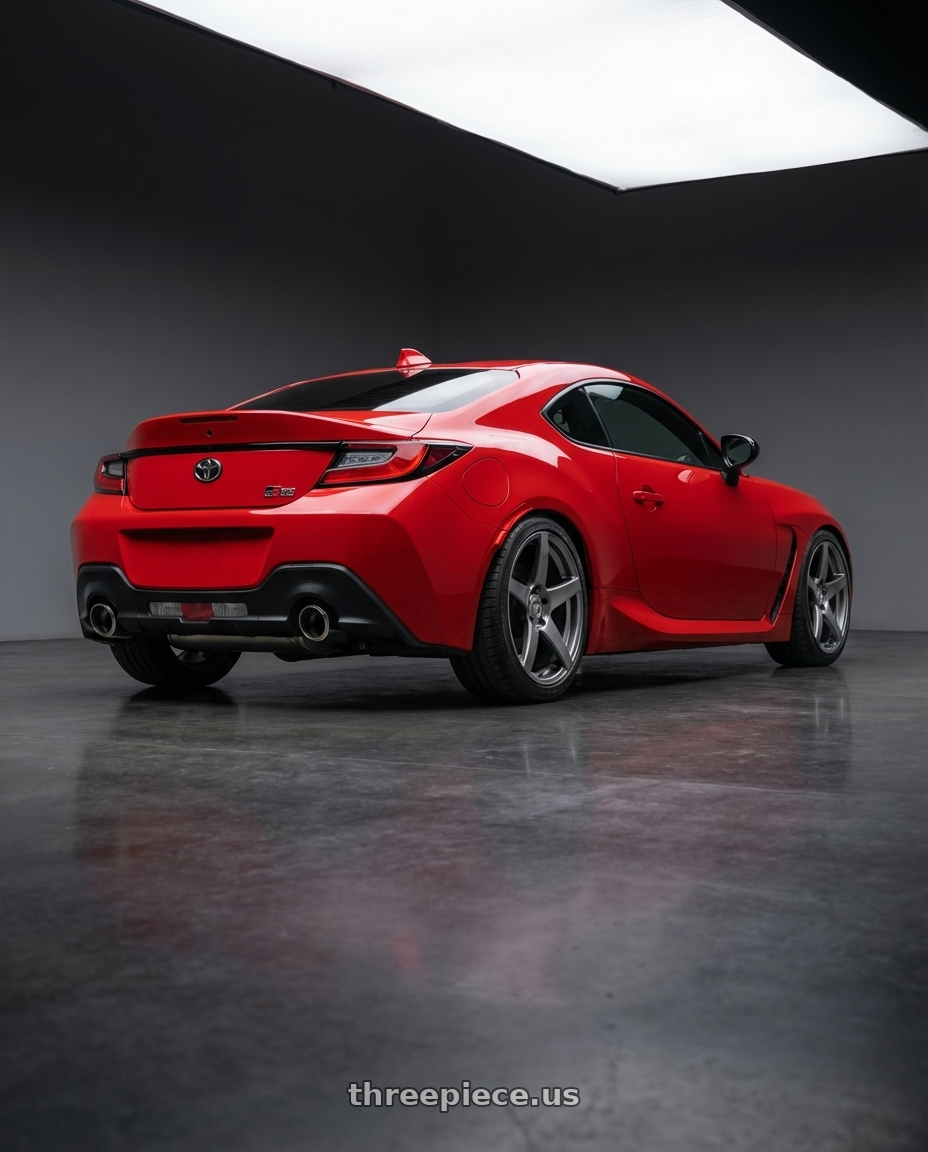 2024 Toyota GR86 with Forgestar CF5 5x114.3 18x9 +35 Gloss Anthracite wheels rear three quarter view square tires