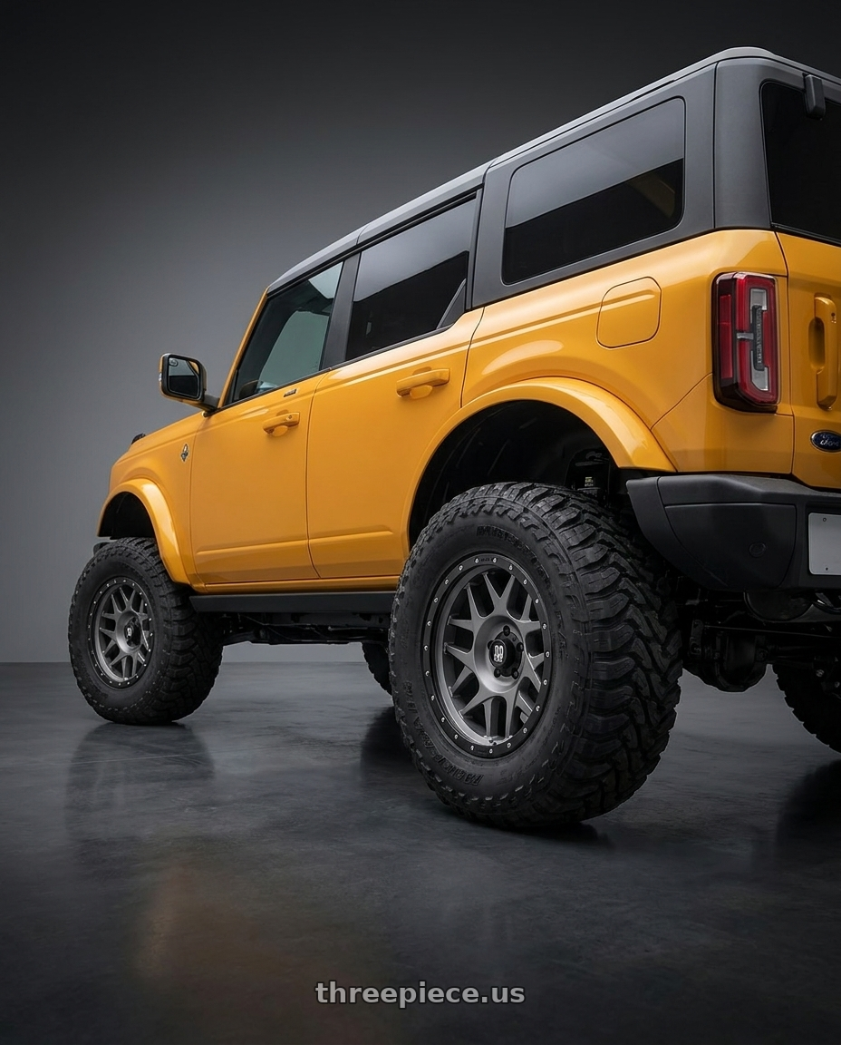 2024 Ford Bronco with XD XD127 BULLY 6X139.7 17X9 -12 MATTE GRAY BLACK RING wheels rear three quarter view meaty tires