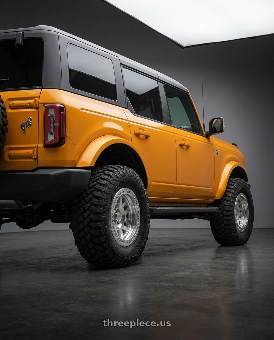 2024 Ford Bronco with KMC KM229 MACHETE CRAWL BEADLOCK 6X139.7 17X9 -38 MACHINED wheels rear three quarter view meaty tires