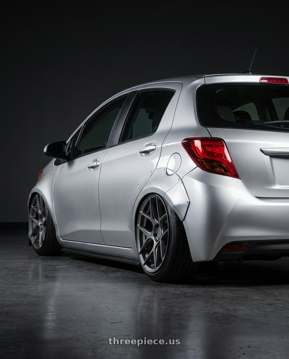 2015 Toyota Yaris with Aodhan AFF2 5x112 19x9.5+35 Matte Gray wheels rear three quarter view slight stretch tires