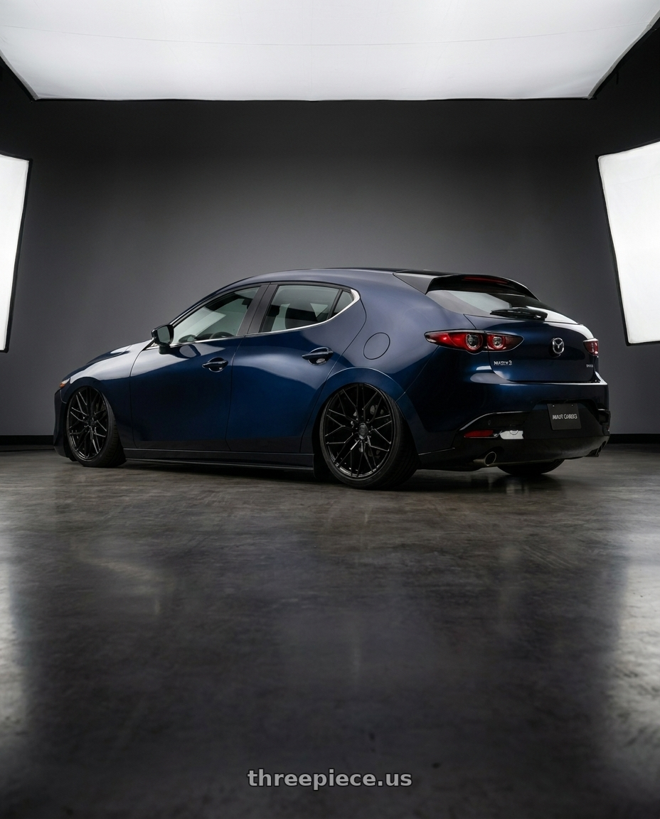 2019 Mazda3 Bp with Avant Garde Wheels M520R 5X112 19x9.5 +40 Gloss Black wheels rear three quarter view slight stretch tires