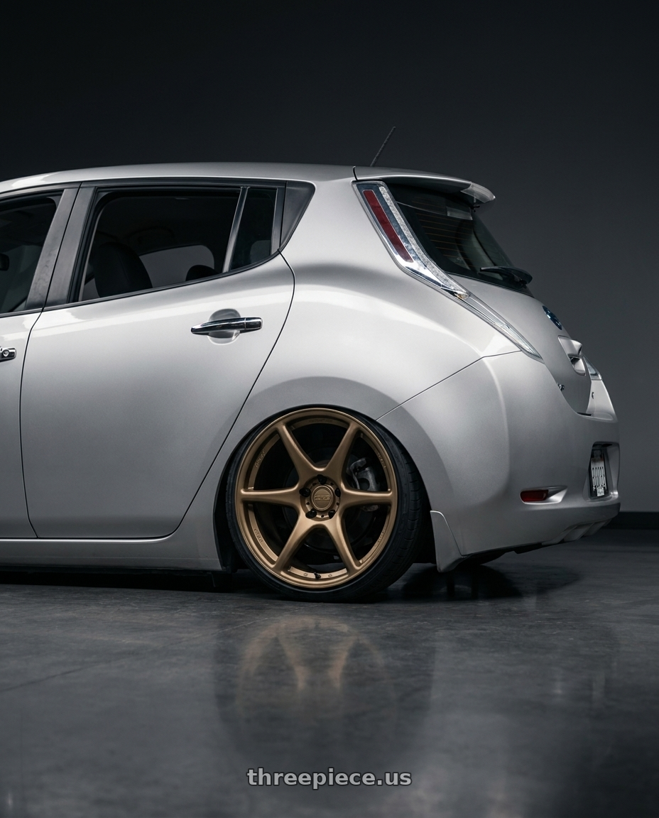 2017 Nissan Leaf with Kansei K11B Tandem 5X112 19x10.5 22 Bronze wheels rear three quarter view slight stretch tires