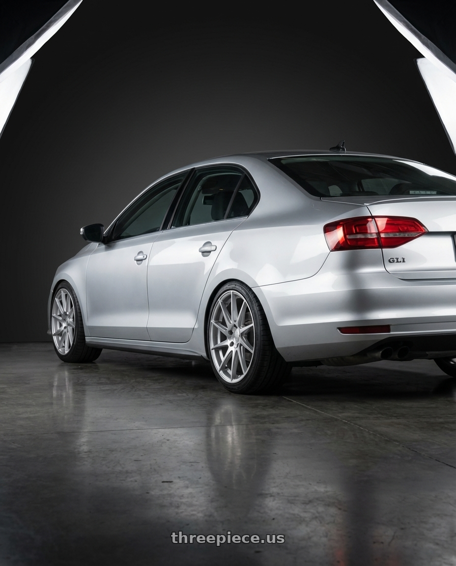 2016 Volkswagen Jetta GLI MK6 with Aodhan AH09 5x112 18x8.5 +35 Gloss Silver Machined Face wheels rear three quarter view square tires