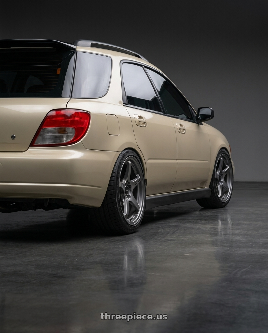 2002 subaru wrx wagon with Enkei TS-5 5x100 17x8+45 Storm Grey wheels rear three quarter view slight stretch tires