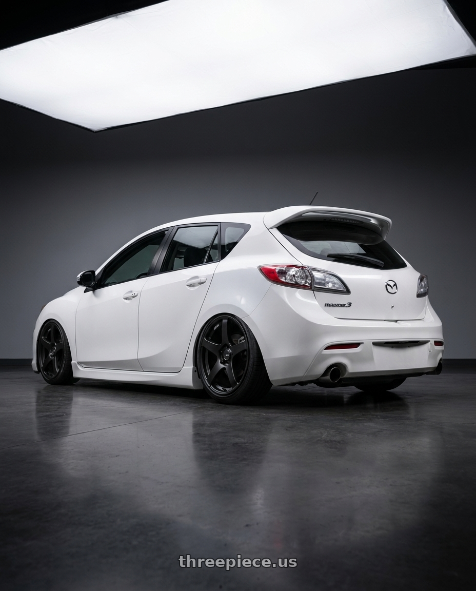 2012 Mazda Mazdaspeed3 with Ssr Gtv01 5x114.3 18x8.5+40  FLAT BLACK wheels rear three quarter view slight stretch tires