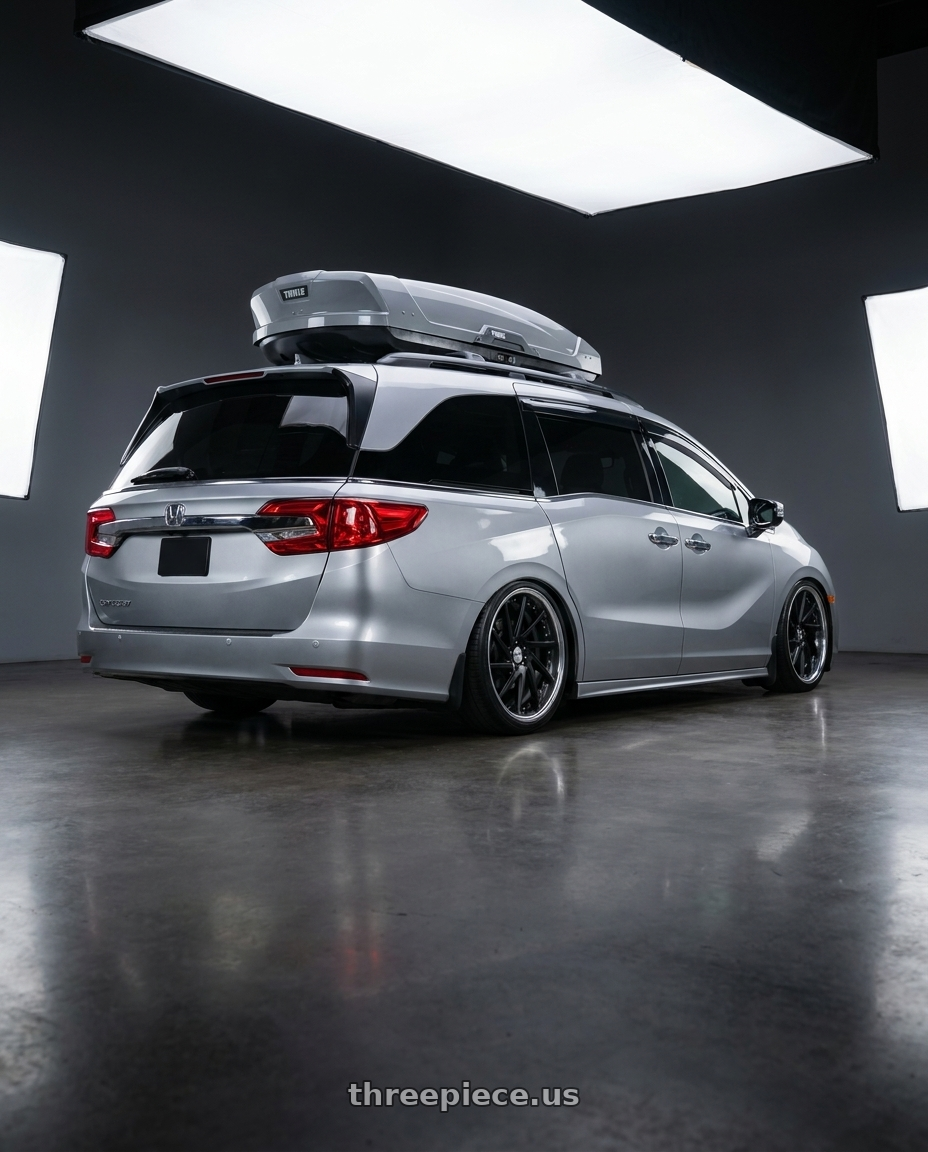 2024 Honda Odyssey with Work Gnosis Cvs 5x120 20x8.5+45 O Disk Matte Black wheels rear three quarter view slight stretch tires