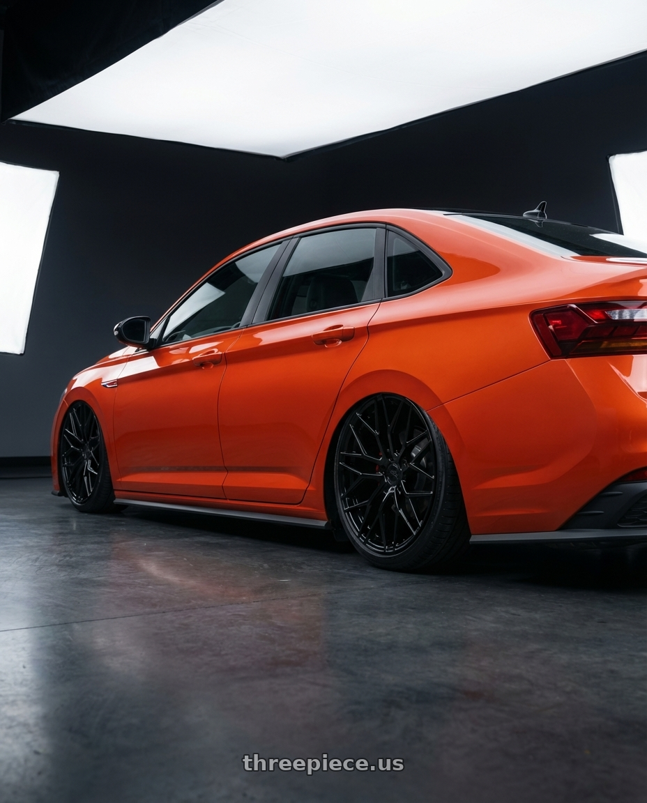 2023 Volkswagen Jetta GLI MK7 with Avant Garde Wheels M520R 5X112 19x9.5 +40 Gloss Black wheels rear three quarter view slight stretch tires