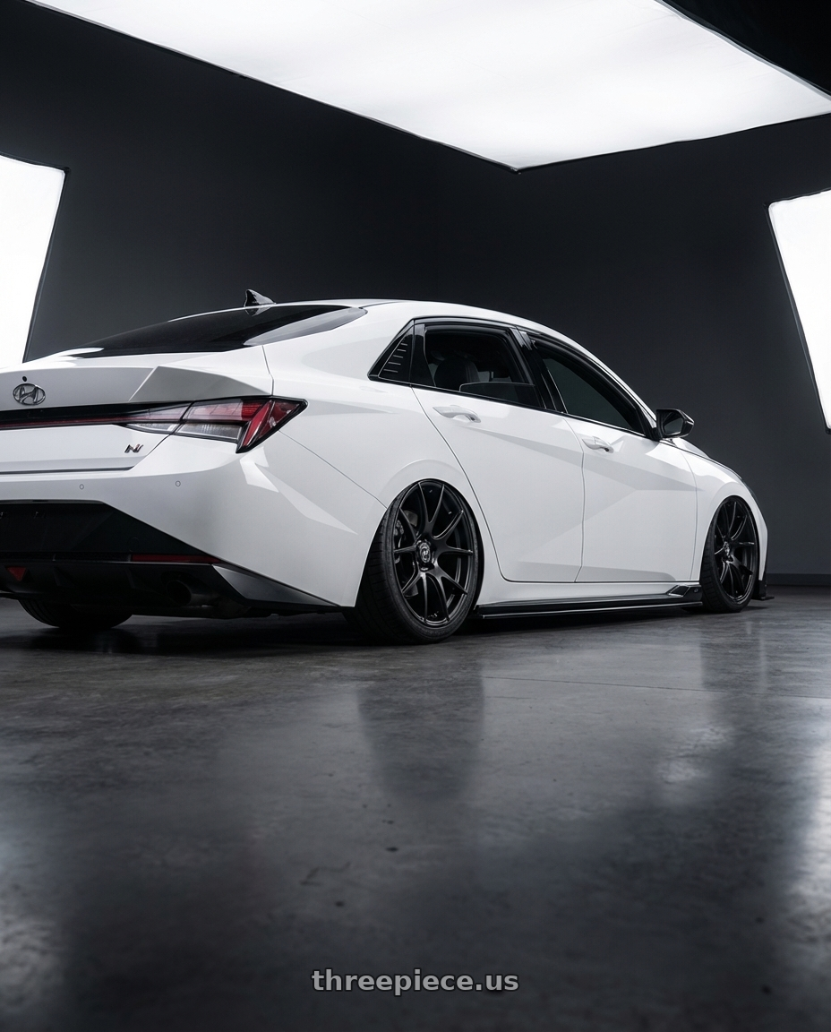 2024 Hyundai Elantra N with Forgestar CF5V 5x114.3 19x9 +35 Satin Black wheels rear three quarter view slight stretch tires