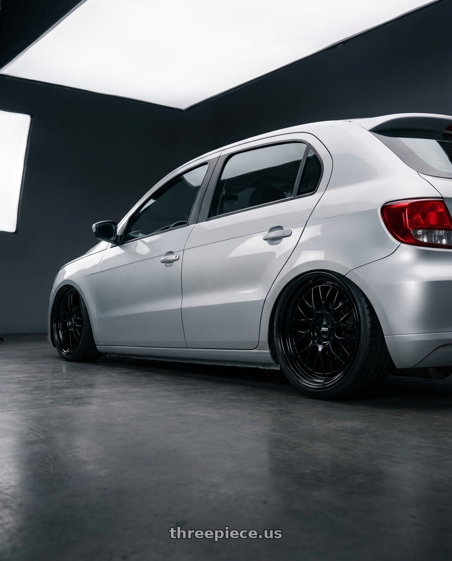 volkswagen gol 4 portas 2012 with P51 Wheels 101RF 5X114.3 19x11.5 +56 Gloss Black wheels rear three quarter view square tires