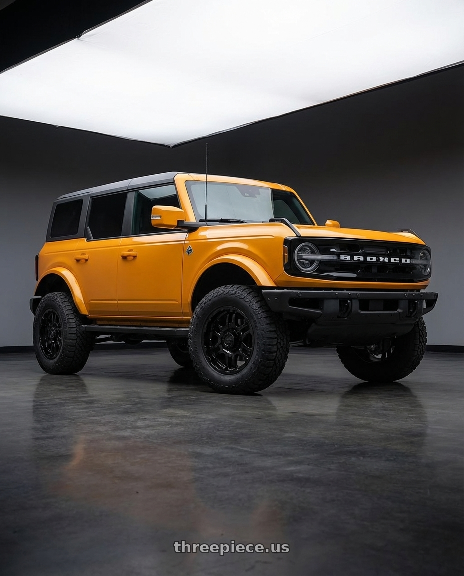 2024 Ford Bronco with Gear Off Road 713B 6x139.7 20x9 +10 Gloss Black wheels front three quarter view lifted stance