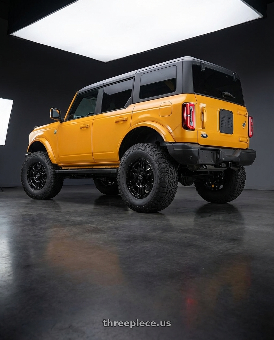 2024 Ford Bronco with Gear Off Road 713B 6x139.7 20x9 +10 Gloss Black wheels rear three quarter view meaty tires