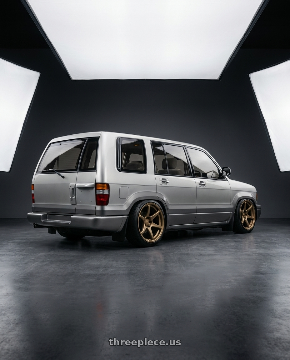 1991 Subaru bighorn with Kansei K11B Tandem 5X112 18x8.5 35 Bronze wheels rear three quarter view slight stretch tires