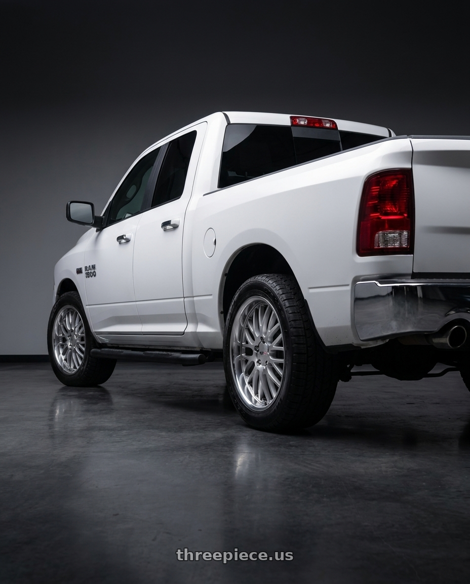 2015 ram 1500 quad cab with Cray MANTA 5X120.65 19X10.5 +65 HYPER SILVER W/ MIRROR CUT LIP wheels rear three quarter view square tires