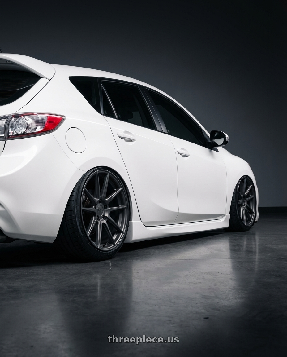 2012 Mazda Mazdaspeed3 with Niche 1PC M116 MISANO 5X114.3 18X8 +40 MATTE GUN METAL wheels rear three quarter view slight stretch tires