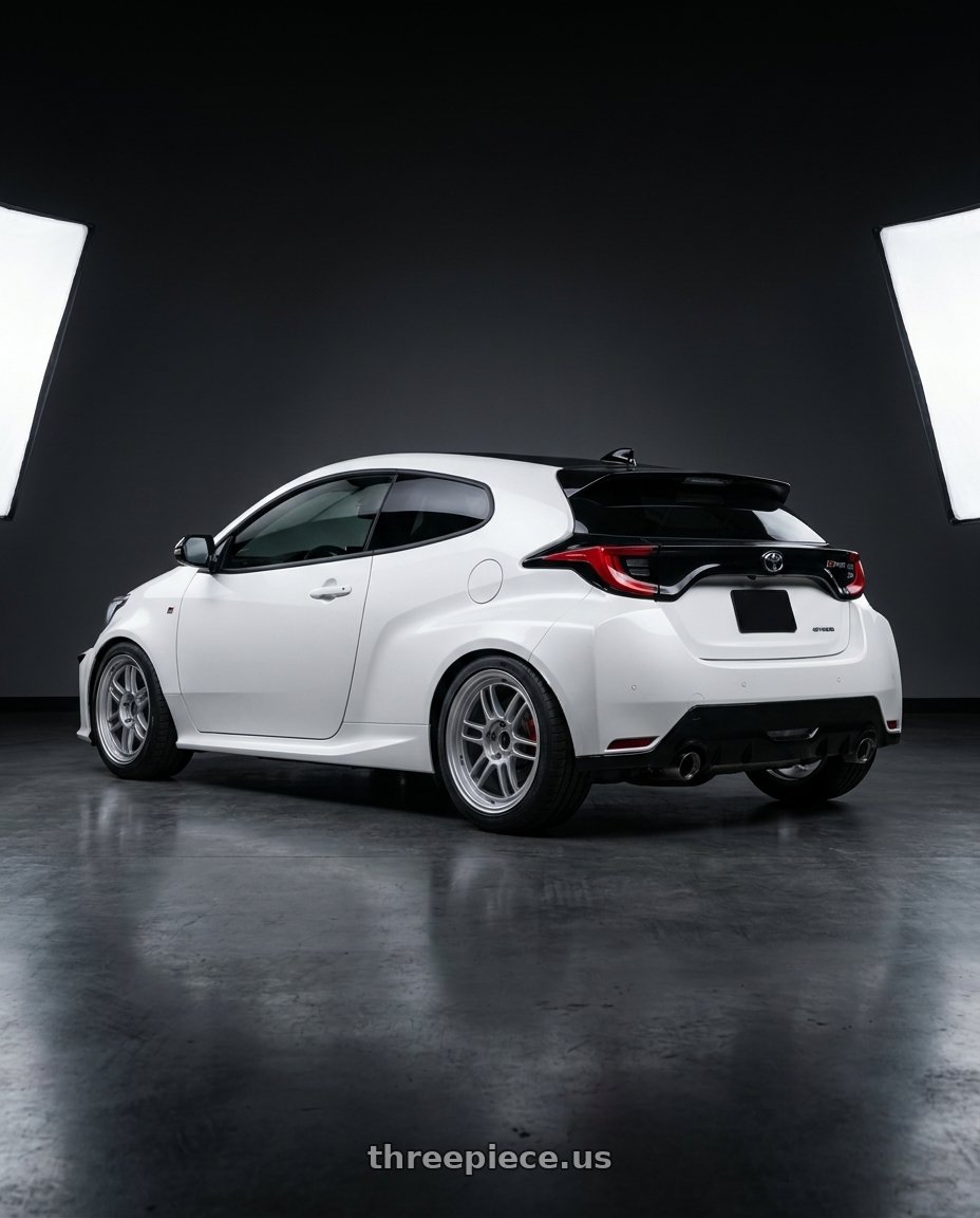 2024 gr yaris with Enkei RPF1 5x114.3 17x7+45 Silver wheels rear three quarter view square tires
