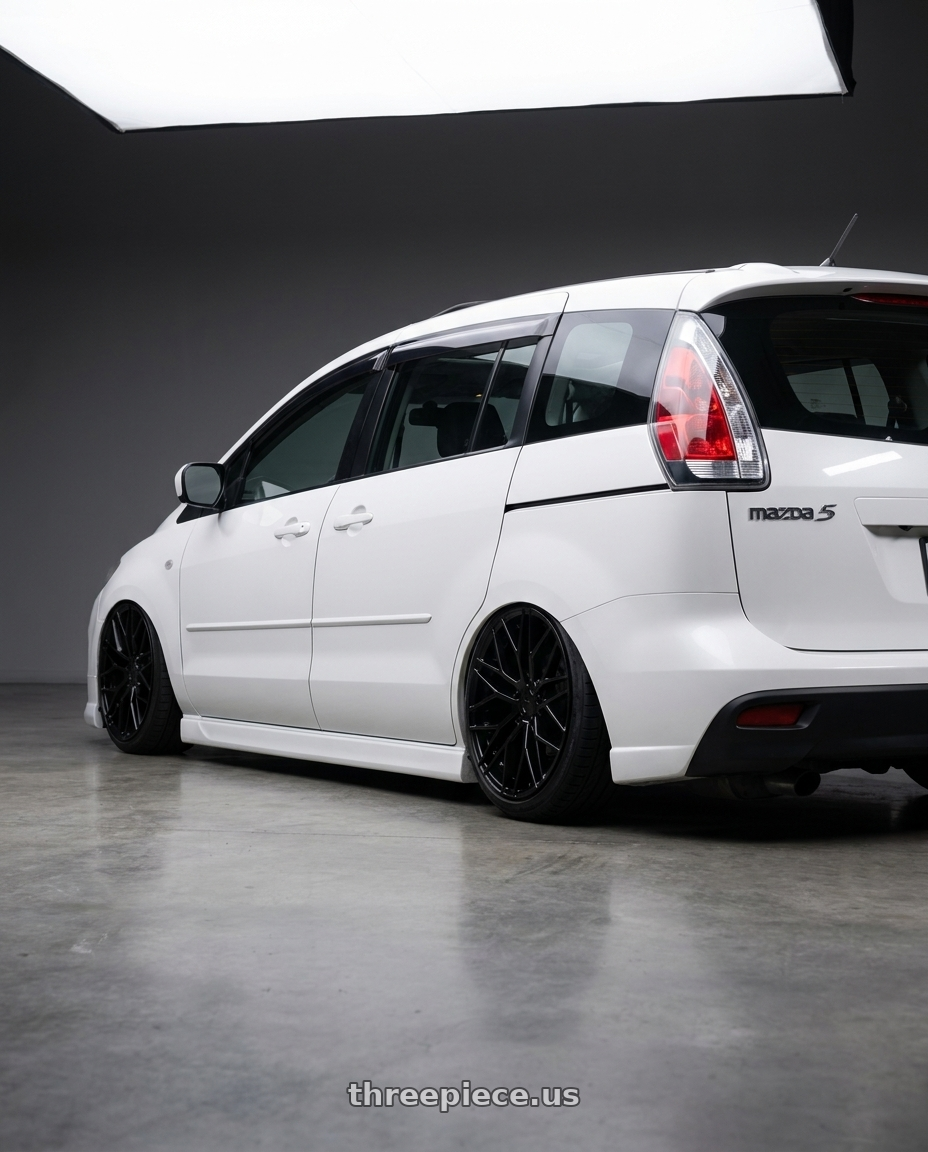 2010 Mazda 5 with KATANA RACING KR01 5x100 17x7.5 +40 Matte Black wheels rear three quarter view slight stretch tires