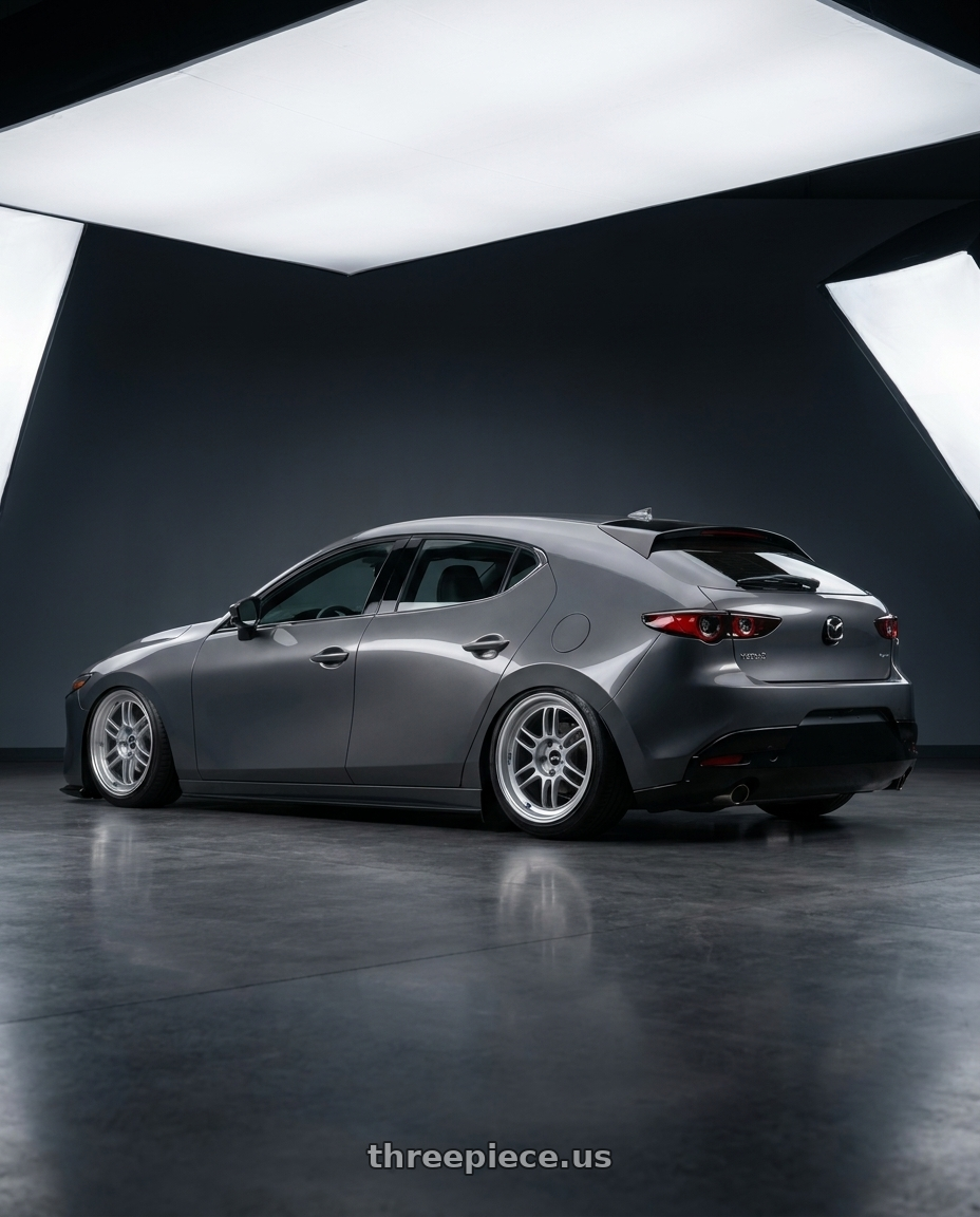 2023 Mazda3 hatchback with Enkei RPF1RS 5x114.3 18x9.5+12 Silver wheels rear three quarter view slight stretch tires
